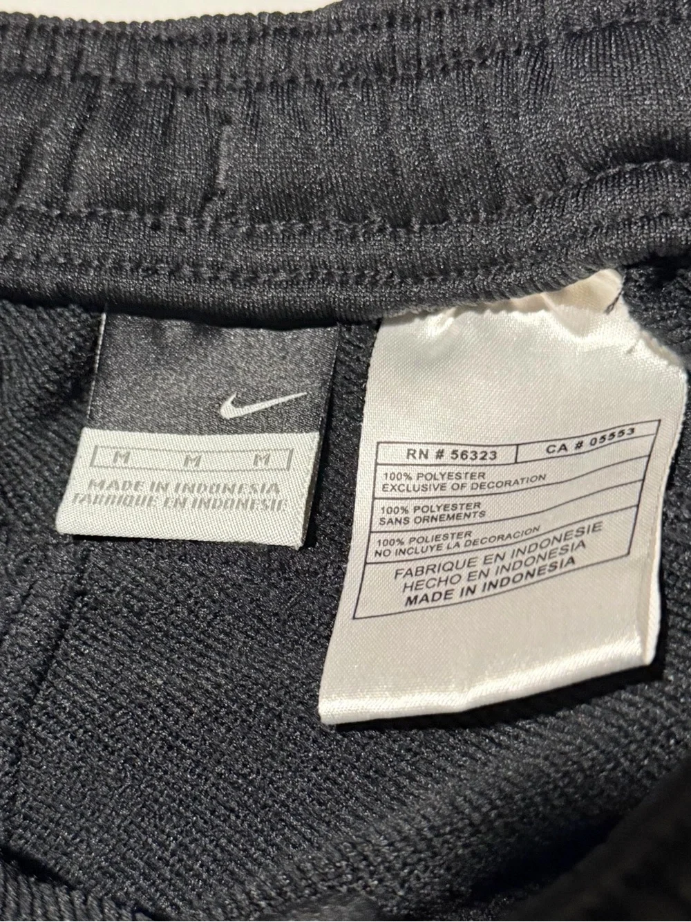 Nike Black Joggers with Yellow Side Stripe and Gold Swoosh
